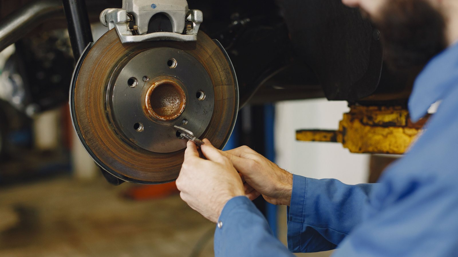 Brake and wheel service being performed at an auto repair shop in Apopka FL