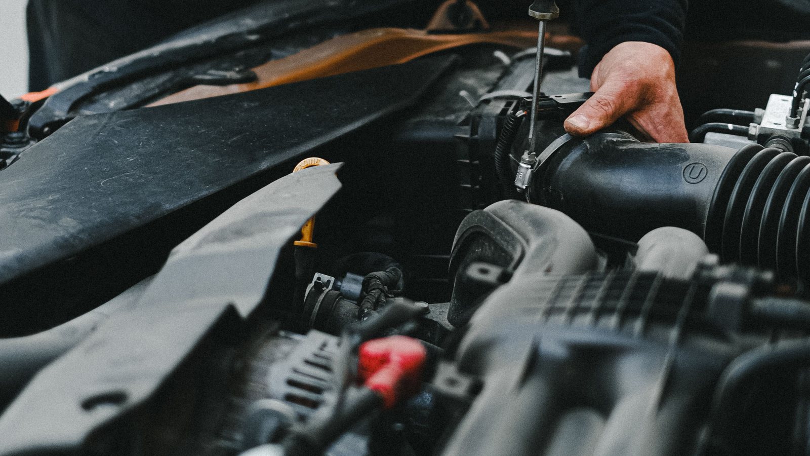 Mechanic working on a car engine for engine and transmission repair in Apopka FL